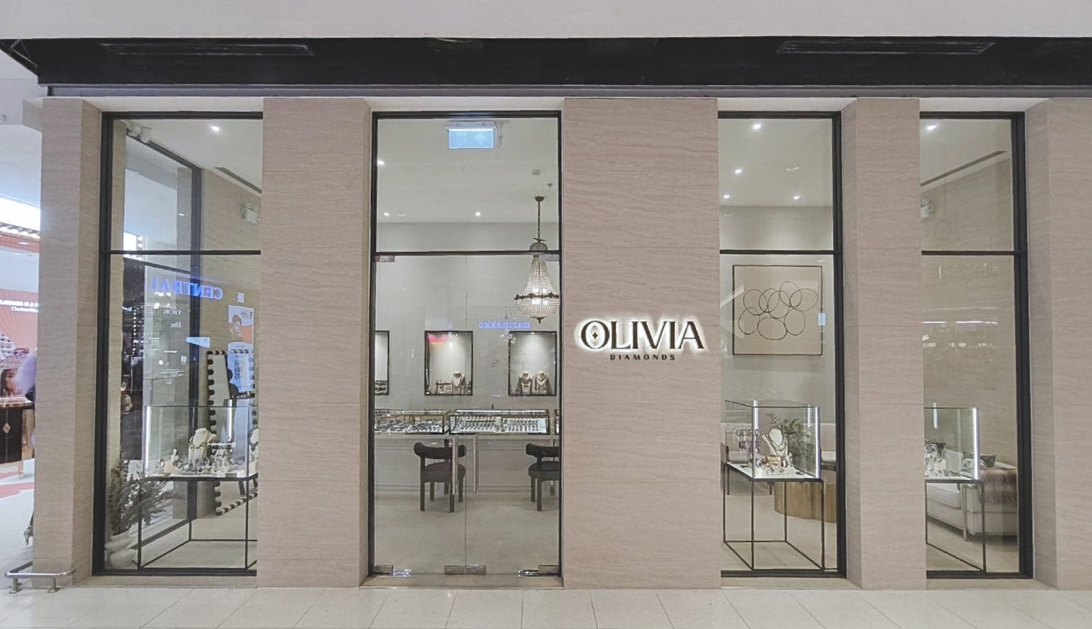 Olivia Diamond CTW — travertine and fine finishes in a jewellery boutique