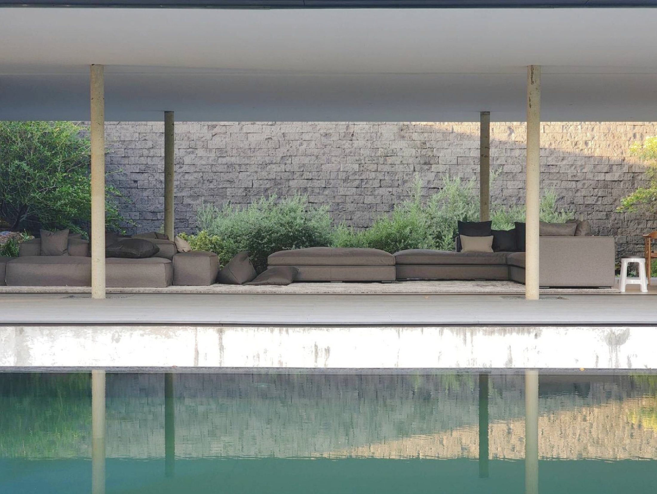 Wa Villa — pool villa interior with clean lines and natural materials
